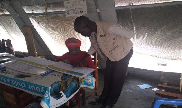 Home afss mentoring a nutrition assistant at rastigi phcu on filling of the miycn register. photo taken by