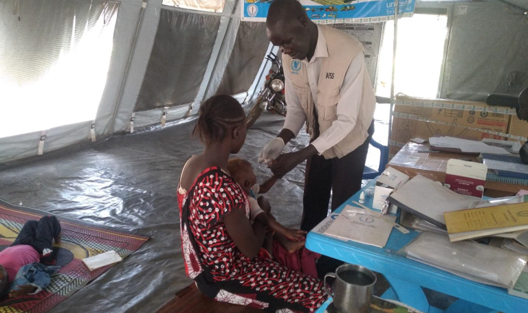 Home afss staff testing a child for malaria at rastigi phcu. photo taken by namajja doreen field nutrition